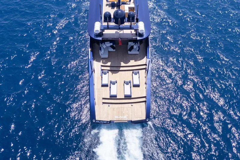  Yacht Photos Pics Aerial view of 2009 MMGI 44m yacht cruising on blue ocean waters.