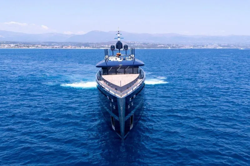  Yacht Photos Pics Luxurious 2009 MMGI 44m yacht cruising on open blue sea.