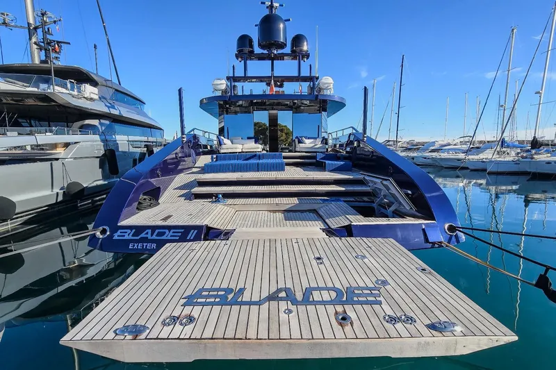  Yacht Photos Pics Luxury yacht "Blade II" docked, MMGI 44m model, 2009, in a marina setting.