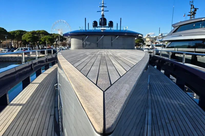  Yacht Photos Pics Luxury yacht MMGI 44m, 2009 model, docked with sleek wooden deck and modern design.