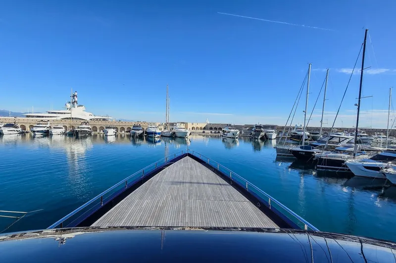  Yacht Photos Pics Luxury yacht MMGI 44m (2009) docked in a serene marina under clear blue skies.