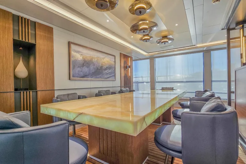  Yacht Photos Pics Luxurious yacht interior with elegant dining area, featuring modern decor and ambient lighting, MMGI 44m 2009.