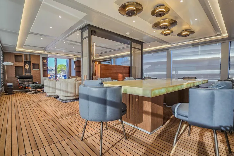  Yacht Photos Pics Luxurious yacht interior with modern furnishings, wooden flooring, and elegant lighting, MMGI 44m, 2009.