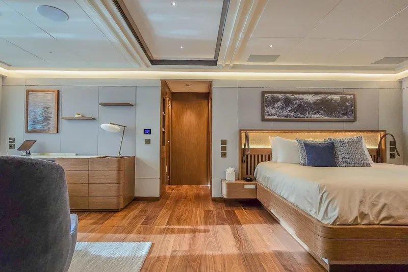  Yacht Photos Pics Luxurious yacht bedroom interior with modern decor, wooden flooring, and ambient lighting, MMGI 44m, 2009.