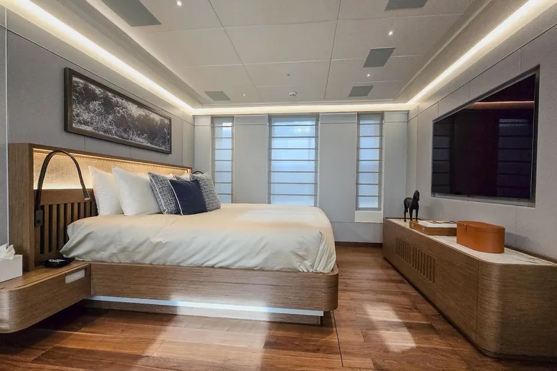  Yacht Photos Pics Luxurious bedroom interior on MMGI 44m yacht, 2009 model, featuring modern design and elegant decor.