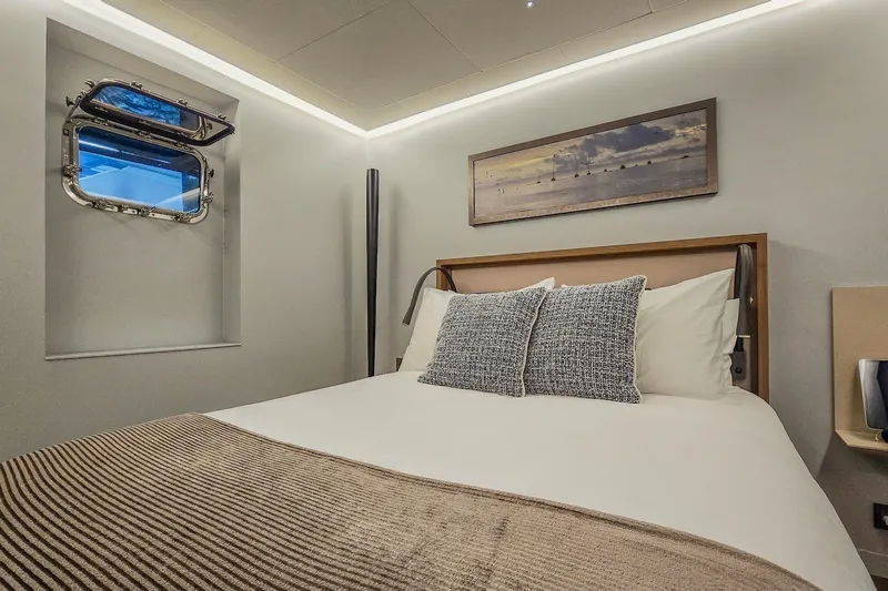  Yacht Photos Pics Luxurious bedroom interior on 2009 MMGI 44m yacht with modern decor and ocean view.
