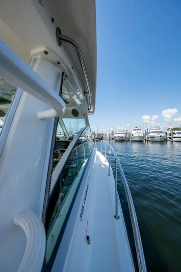  Yacht Photos Pics 2015 Boston Whaler 345 Conquest docked at marina under clear blue sky.