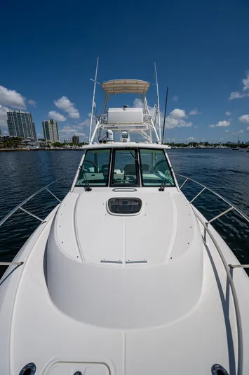  Yacht Photos Pics 2015 Boston Whaler 345 Conquest boat on calm water under clear blue sky.