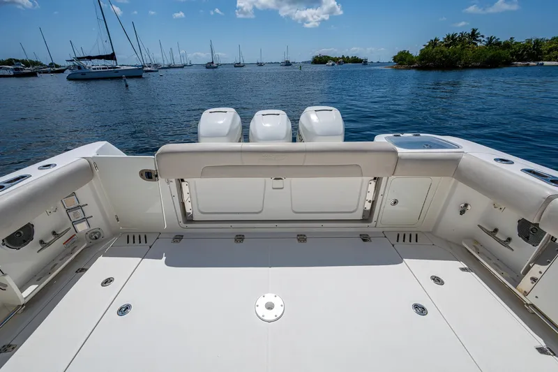  Yacht Photos Pics 2015 Boston Whaler 345 Conquest boat deck with ocean view and moored sailboats.