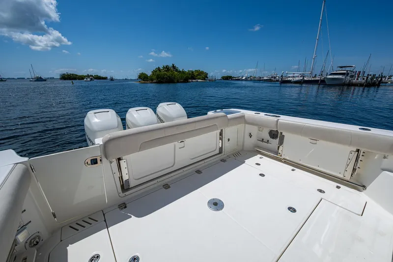  Yacht Photos Pics 2015 Boston Whaler 345 Conquest boat deck with ocean view and marina in background.