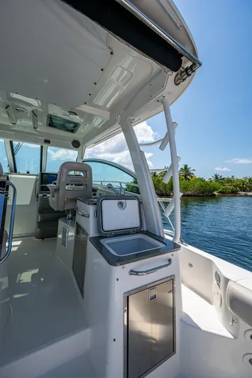  Yacht Photos Pics 2015 Boston Whaler 345 Conquest boat interior with sleek design and modern amenities.