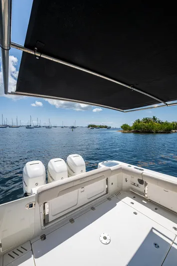  Yacht Photos Pics Boston Whaler 345 Conquest 2015 boat with triple engines, scenic ocean view.