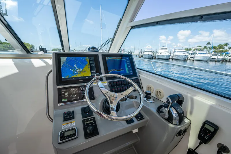  Yacht Photos Pics Helm of 2015 Boston Whaler 345 Conquest with navigation screens and controls.
