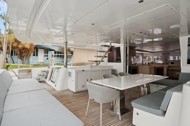 Nomada Yacht Photos Pics 2014 Lagoon 620 yacht interior with spacious seating and dining area.