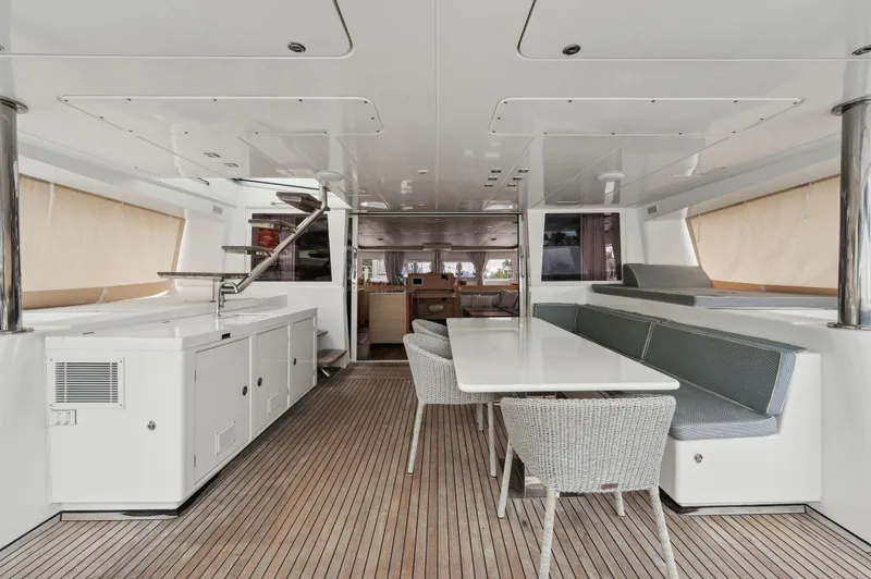 Nomada Yacht Photos Pics Spacious interior of 2014 Lagoon 620 yacht with modern seating and dining area.