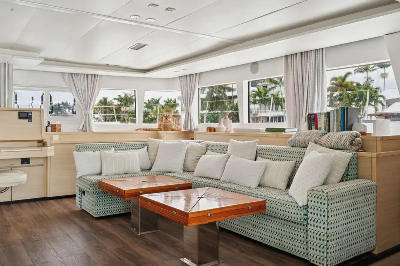 Nomada Yacht Photos Pics Luxurious interior of 2014 Lagoon 620 yacht with elegant seating and modern decor.