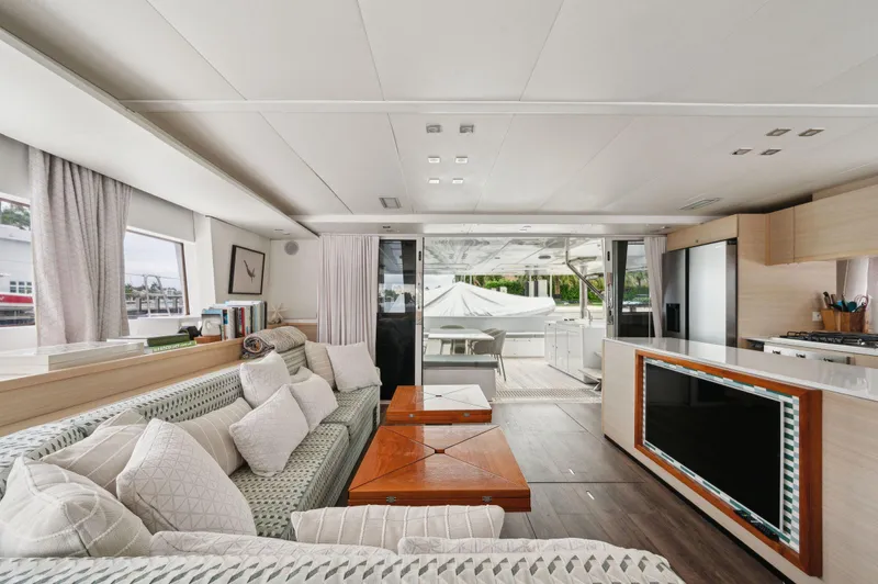 Nomada Yacht Photos Pics Luxurious interior of 2014 Lagoon 620 yacht with modern furnishings and spacious layout.