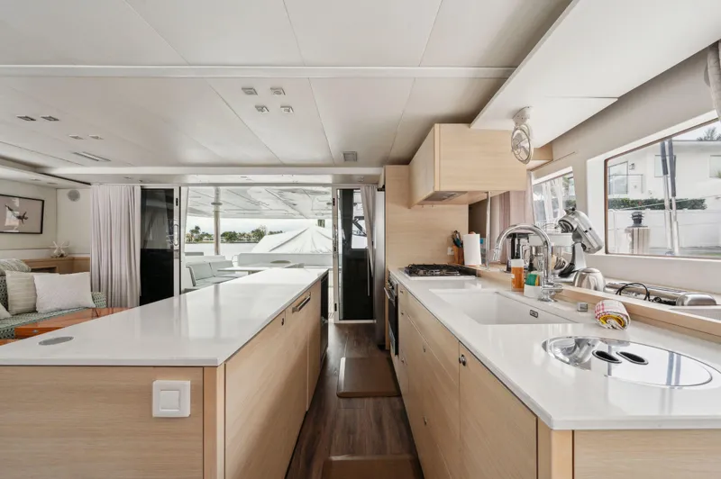 Nomada Yacht Photos Pics Interior of 2014 Lagoon 620 yacht, featuring modern kitchen and spacious design.