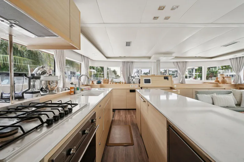 Nomada Yacht Photos Pics Spacious kitchen interior of 2014 Lagoon 620 yacht with modern appliances and ample counter space.