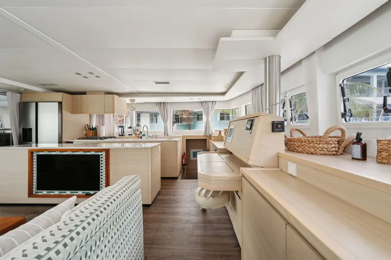 Nomada Yacht Photos Pics Luxurious interior of 2014 Lagoon 620 yacht with modern furnishings and ample natural light.