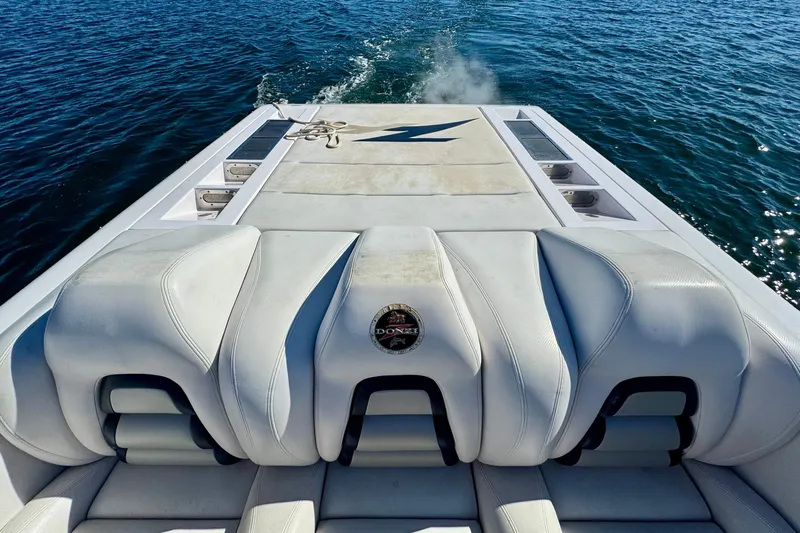 Jah Love Yacht Photos Pics 2015 Donzi 38 ZR boat with white seating, cruising on open water.