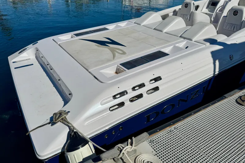 Jah Love Yacht Photos Pics 2015 Donzi 38 ZR speedboat docked, featuring sleek design and comfortable seating.