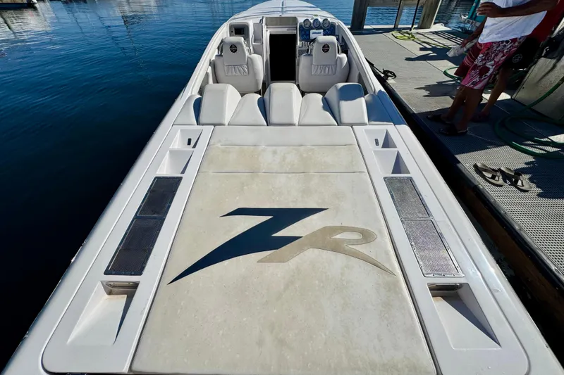 Jah Love Yacht Photos Pics 2015 Donzi 38 ZR speedboat docked, featuring sleek design and comfortable seating.