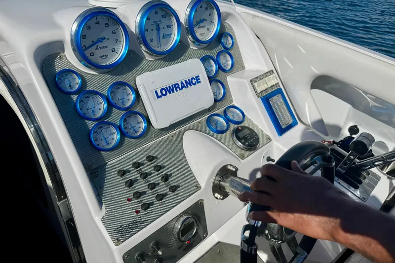 Jah Love Yacht Photos Pics Dashboard of a 2015 Donzi 38 ZR boat with gauges and steering wheel.