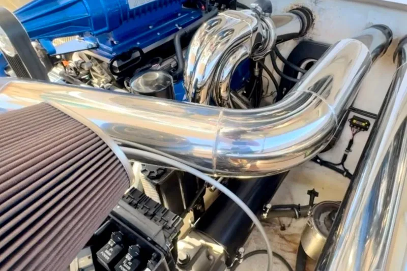 Jah Love Yacht Photos Pics Engine compartment of a 2015 Donzi 38 ZR with polished metal components.
