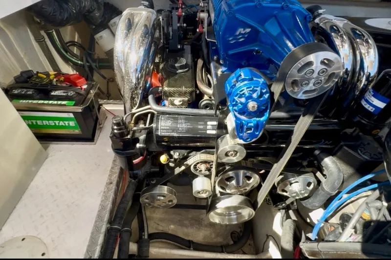 Jah Love Yacht Photos Pics Engine compartment of a 2015 Donzi 38 ZR boat, featuring a powerful motor and battery.