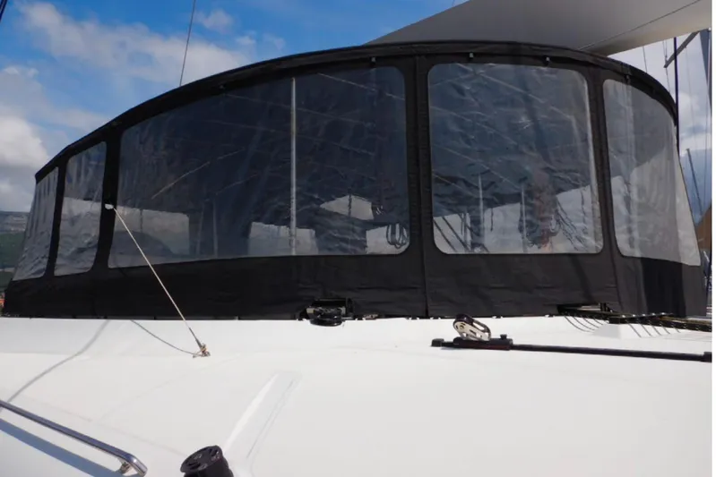 Masterdream Yacht Photos Pics Lagoon 620 Esense 2018 yacht with enclosed cockpit, featuring clear panels and black trim.