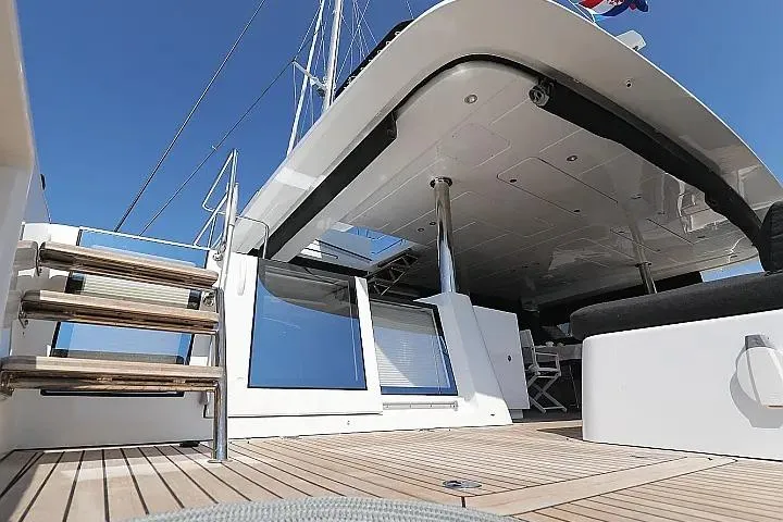 Masterdream Yacht Photos Pics 2018 Lagoon 620 Esense yacht deck with stairs and seating area.