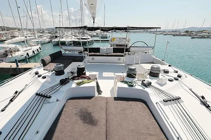Masterdream Yacht Photos Pics 2018 Lagoon 620 Esense yacht deck with marina view, featuring modern sailing equipment.