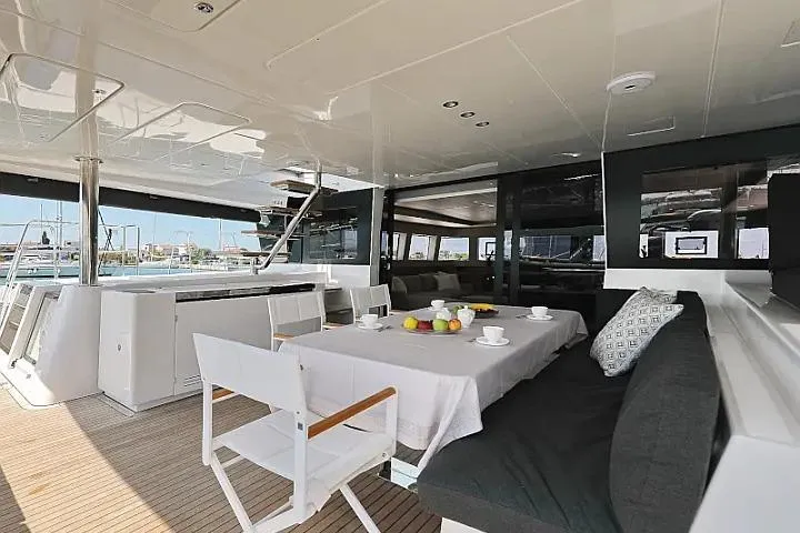 Masterdream Yacht Photos Pics Luxurious Lagoon 620 Esense 2018 yacht interior with dining area and modern furnishings.