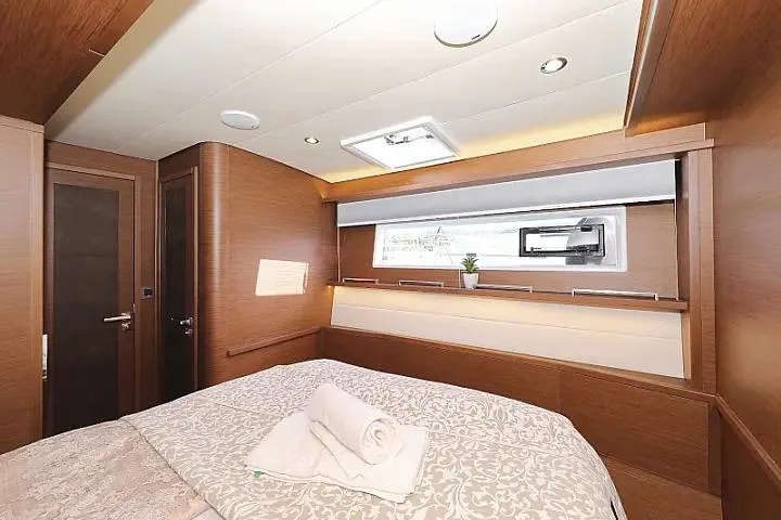 Masterdream Yacht Photos Pics Luxurious cabin interior of 2018 Lagoon 620 Esense yacht with elegant wood finish.