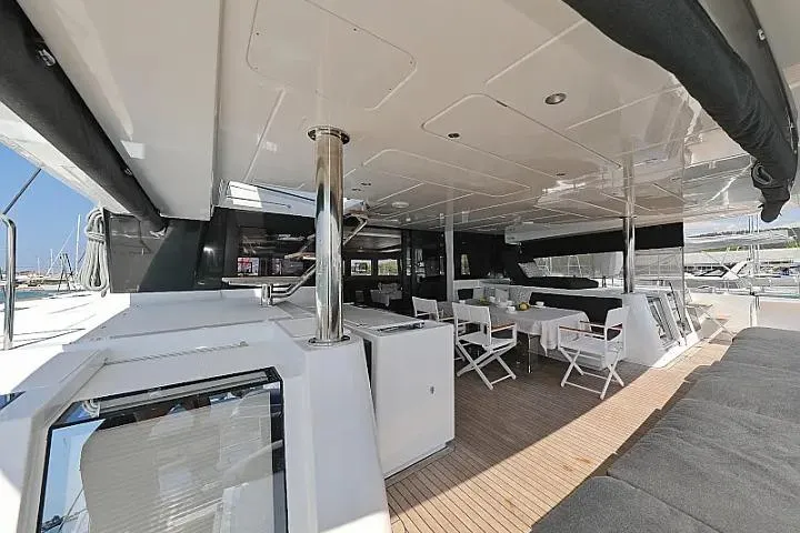 Masterdream Yacht Photos Pics Spacious deck of 2018 Lagoon 620 Esense yacht with seating and dining area.