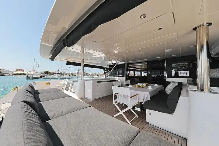 Masterdream Yacht Photos Pics Luxurious 2018 Lagoon 620 Esense yacht with spacious outdoor seating and dining area.