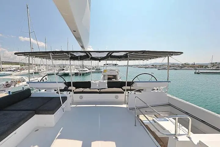 Masterdream Yacht Photos Pics Luxurious 2018 Lagoon 620 Esense yacht with spacious deck and marina view.