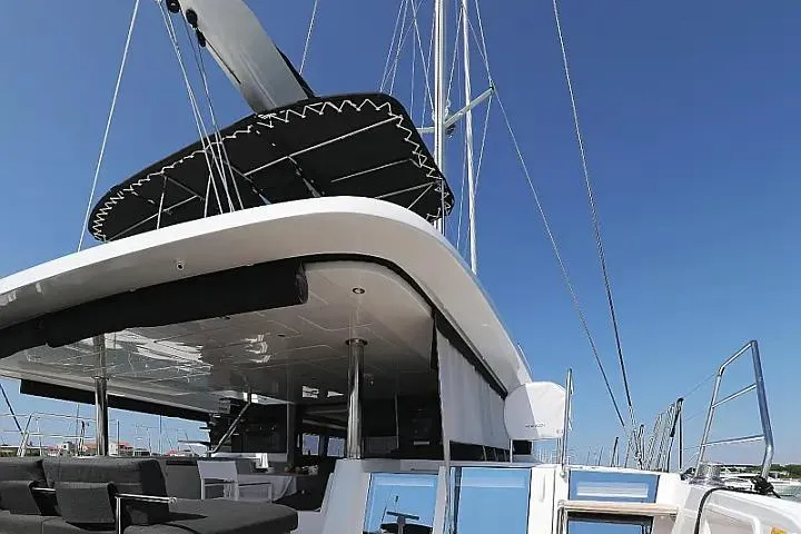 Masterdream Yacht Photos Pics 2018 Lagoon 620 Esense catamaran with sleek design and spacious deck under clear blue sky.