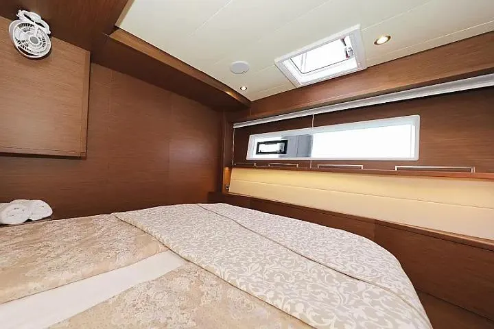 Masterdream Yacht Photos Pics Luxurious cabin interior of 2018 Lagoon 620 Esense yacht with elegant bedding and wood finish.