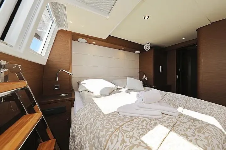Masterdream Yacht Photos Pics Luxurious bedroom interior of 2018 Lagoon 620 Esense yacht with elegant bedding and natural light.