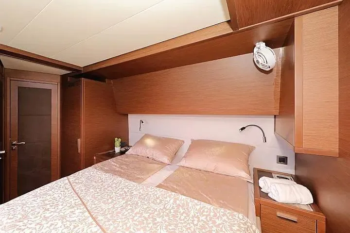 Masterdream Yacht Photos Pics Luxurious cabin interior of 2018 Lagoon 620 Esense yacht with elegant bedding and wood finish.