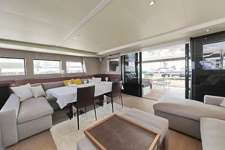 Masterdream Yacht Photos Pics Luxurious interior of 2018 Lagoon 620 Esense yacht with modern dining and lounge area.