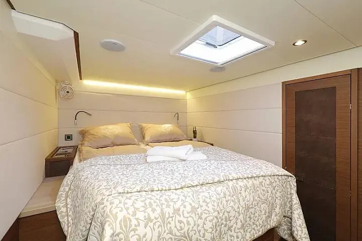 Masterdream Yacht Photos Pics Luxurious bedroom interior of 2018 Lagoon 620 Esense yacht with skylight and elegant bedding.