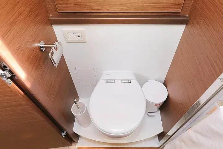 Masterdream Yacht Photos Pics Modern bathroom in 2018 Lagoon 620 Esense yacht with sleek toilet and wooden accents.