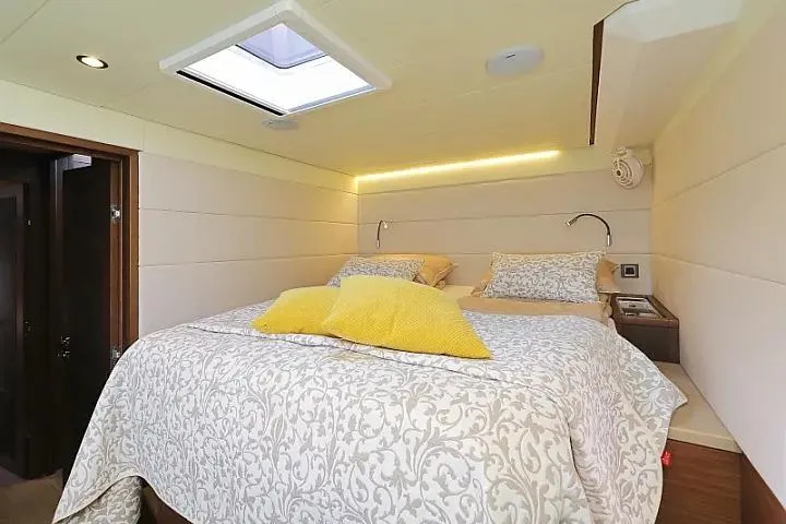 Masterdream Yacht Photos Pics Luxurious bedroom interior of 2018 Lagoon 620 Esense yacht with elegant bedding and skylight.