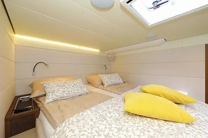 Masterdream Yacht Photos Pics Luxurious cabin interior of 2018 Lagoon 620 Esense yacht with elegant bedding and lighting.
