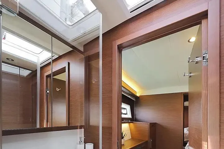 Masterdream Yacht Photos Pics Luxurious interior of 2018 Lagoon 620 Esense yacht with modern wood finish.