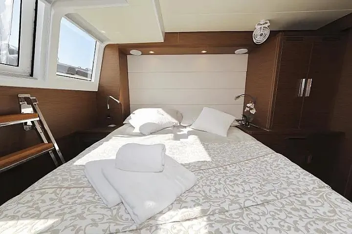 Masterdream Yacht Photos Pics Luxurious bedroom interior of 2018 Lagoon 620 Esense yacht with elegant bedding and natural light.