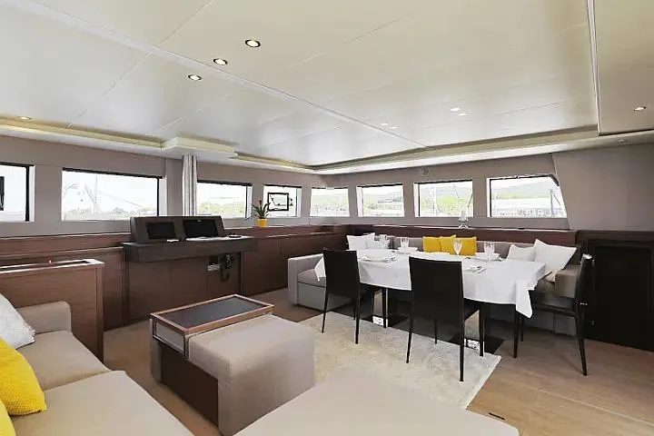 Masterdream Yacht Photos Pics Luxurious interior of 2018 Lagoon 620 Esense yacht with elegant dining area and modern decor.